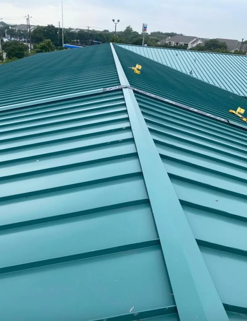 Green commercial metal roof ridge and valley for Metal Roof Repair in Nixa