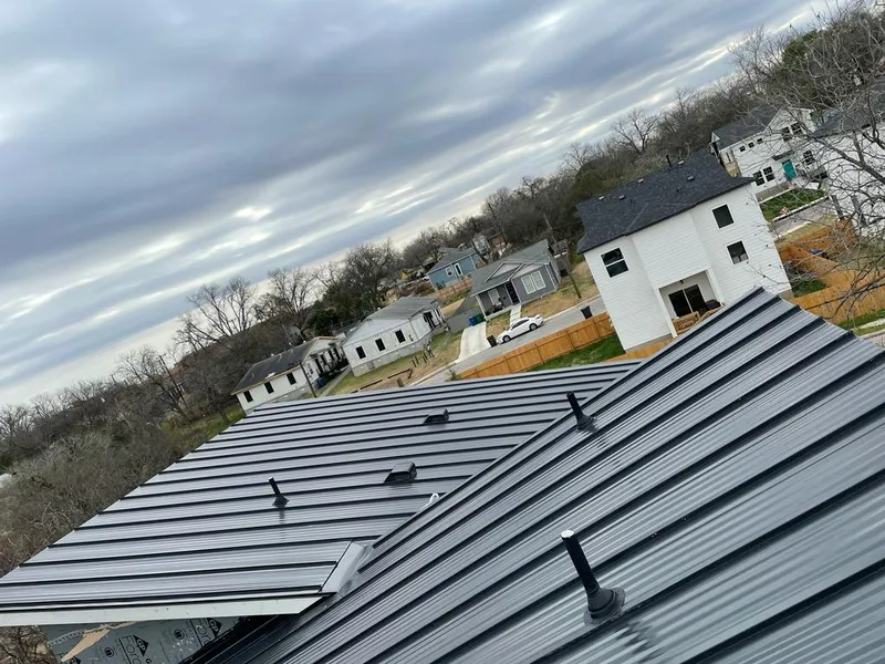 Standing seam metal roof panels with vents for Skylight Repair in Nixa